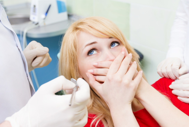 Woman Fearing The Dentist | Pain Free Dentistry