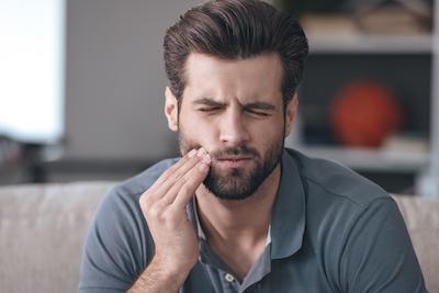 man needing to go to the emergency dentist royal palm beach, FL