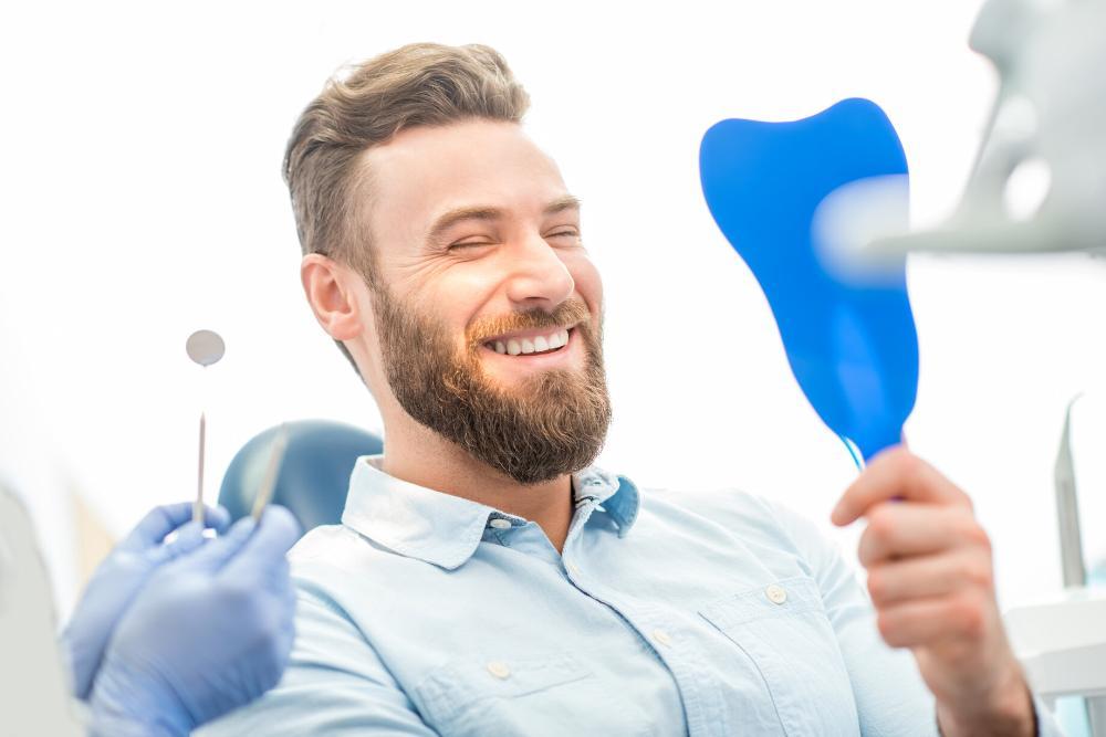 dentures royal palm beach | man at dentist
