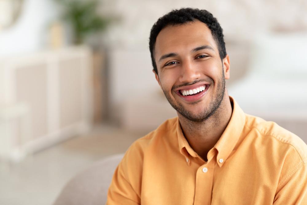 man smiling after root canal in royal palm beach