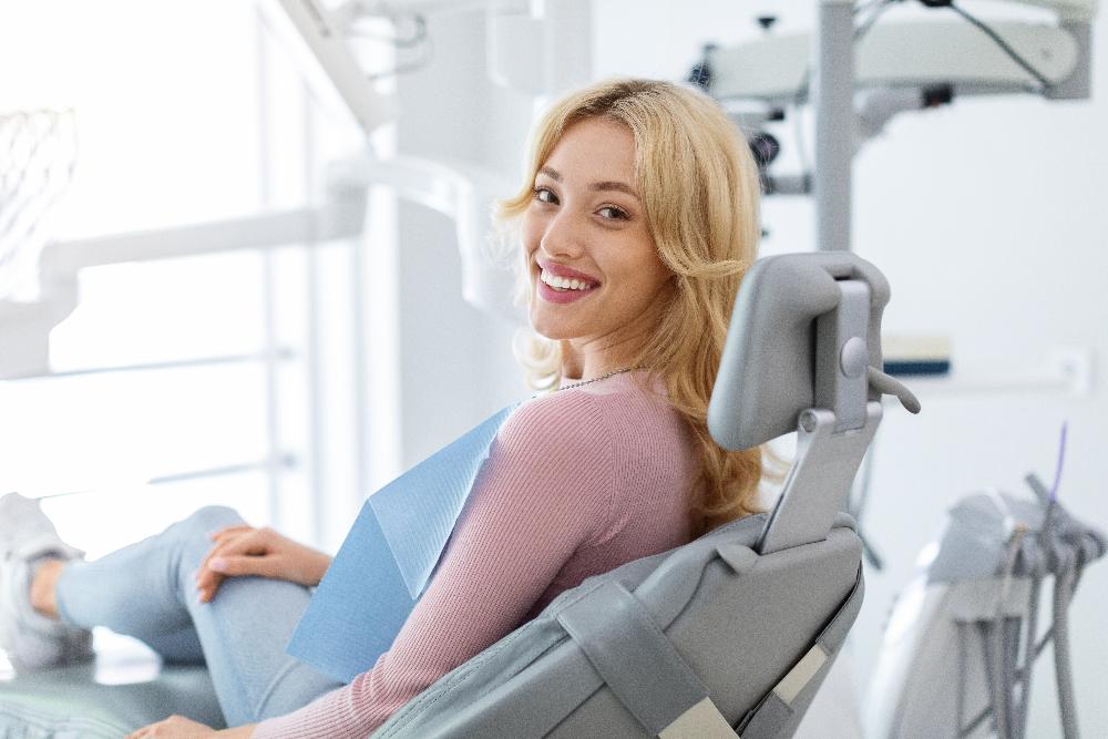 tooth extraction royal palm beach | woman at dentist