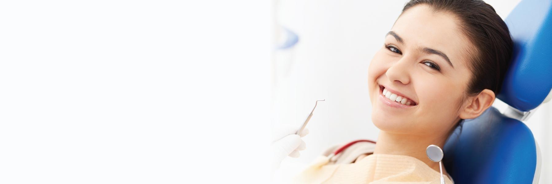 woman smiling in dental chair in royal palm beach