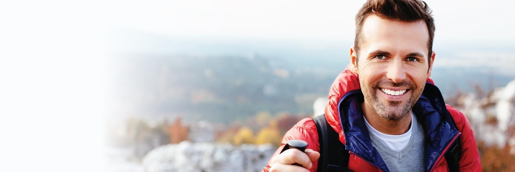 wellington Man in red jacket smiling