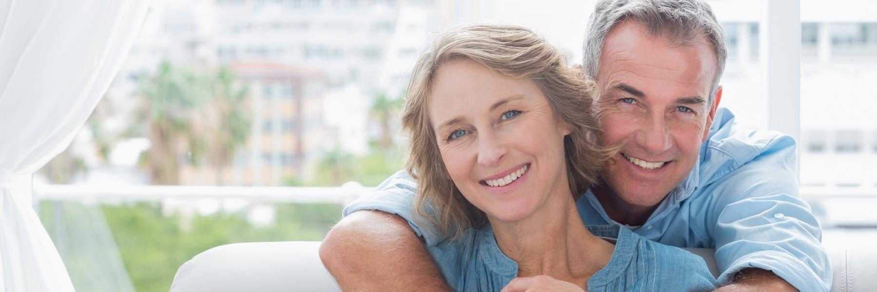 couple with dental implants royal palm beach